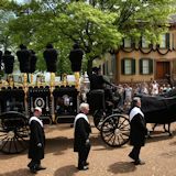 Lincoln Hearse with casket passes by the Lincoln Home